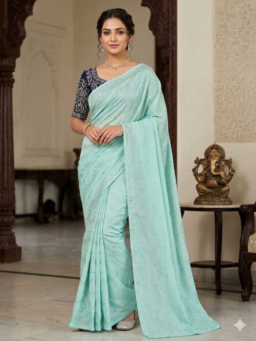 This elegant saree features a refreshing mint green